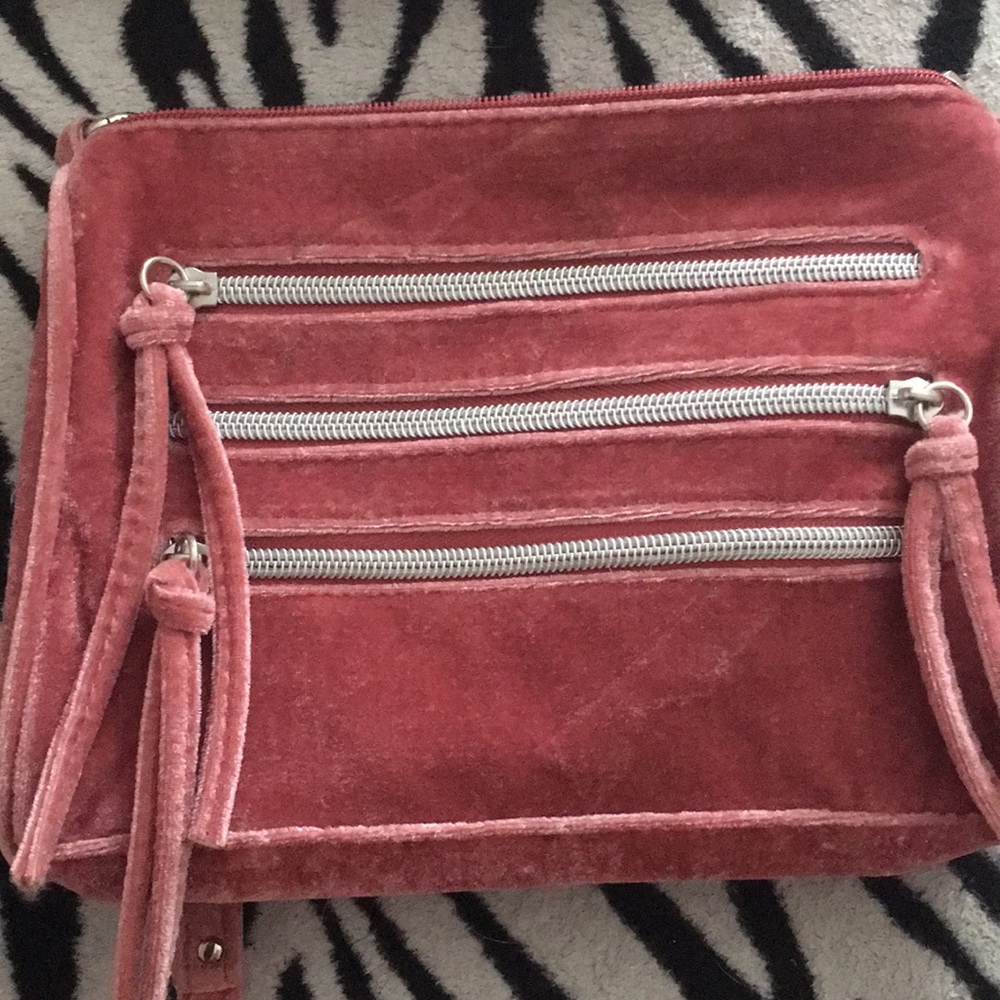A pink bag with chains